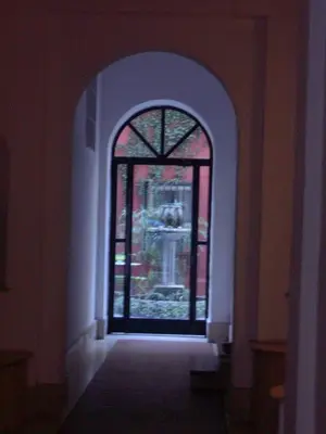 a door with a stained glass window in a hallway at Vacanze al Colosseo Polveriera in Rome