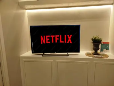 a television sitting on top of a white cabinet at Pon Pon Sweet Home in Rome