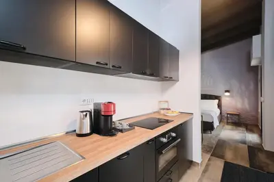 a kitchen with a counter top with a coffee maker at Le Arcate, suite 1 Lavinia, suite 2 Lucilla in Rome