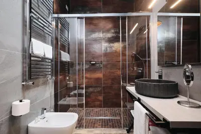 a bathroom with a shower with a sink and a toilet at Le Arcate, suite 1 Lavinia, suite 2 Lucilla in Rome