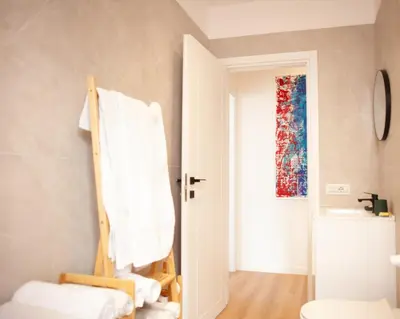 a bathroom with a towel hanging on a chair at Casa Monteverde near Trastevere and the city center in Rome