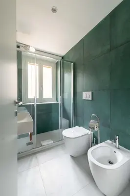 a bathroom with a sink and a toilet and a shower at Domus 50 in Rome