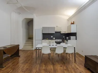 a kitchen and dining room with a table and chairs at Apartment Plinio by Interhome in Rome
