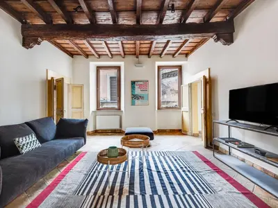 a living room with a couch and a tv at Apartment Pantheon View by Interhome in Rome