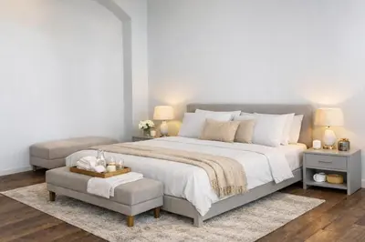 a bedroom with a large white bed and a chair at Vatican Pertusa Luxury Suites by Quinto Piano in Rome