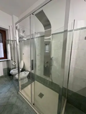 a bathroom with a shower and a toilet at Residenza Piramide in Rome