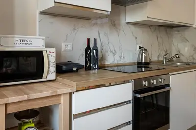 a kitchen with a counter top with a microwave at Il balconcino di Emma in Rome