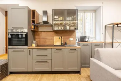 a kitchen with stainless steel cabinets and a sink at Appartamento My Happy Place Rome in Rome