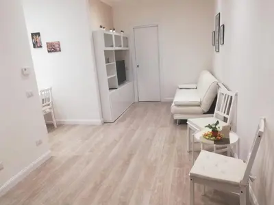 a living room with a couch and a chair at New Jebs sweet home Rome in Rome