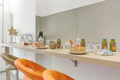a counter with food and drinks on top of it at Marconi APT per Famiglie - 20 Min dal centro in Rome