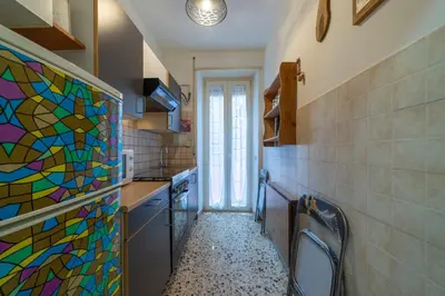a bathroom with a stained glass window and a sink at Lemon House in Rome