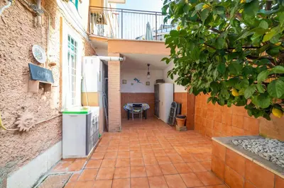 an empty courtyard of a building with a balcony at Lemon House in Rome