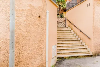 a set of stairs next to a building at Domvs Romana in Rome