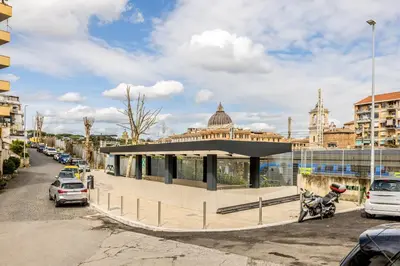 a building with a motorcycle parked in a parking lot at Domvs Romana in Rome