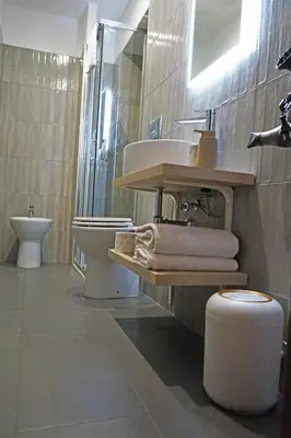 a bathroom with a sink and a toilet at Stay Smart Termini Esquilino in Rome