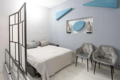 a living room with a glass table and chairs at Lounge House Vatican - San Pietro in Rome
