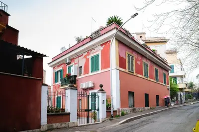 a colorful house on the side of a street at Sette Chiese Apartment in Rome