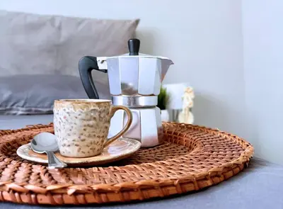 a tray with a coffee maker and a coffee pot on a table at Casa vacanze Roma Adelaide's house in Rome