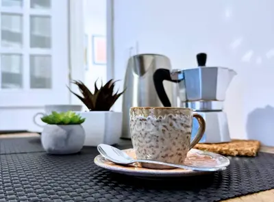 a coffee cup and a saucer on a table at Casa vacanze Roma Adelaide's house in Rome
