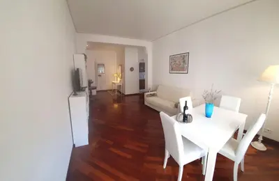 a living room with a white table and white chairs at Holiday apartment in Rome in Rome