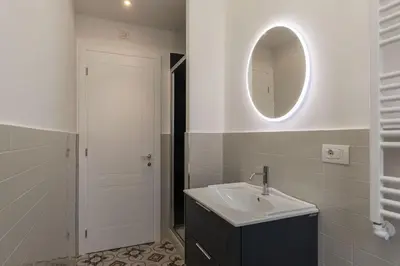a bathroom with a sink and a mirror at La casa di Oreste al Vaticano in Rome