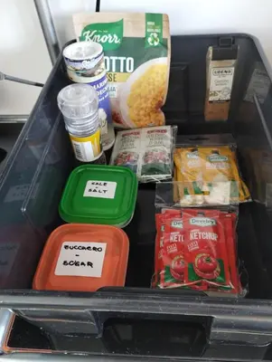 a lunch box with various food items in it at Il Mulo Volante - Panoramico attico con terrazzo a Trastevere in Rome