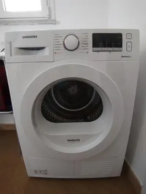 a white washing machine sitting in a room at Il Mulo Volante - Panoramico attico con terrazzo a Trastevere in Rome
