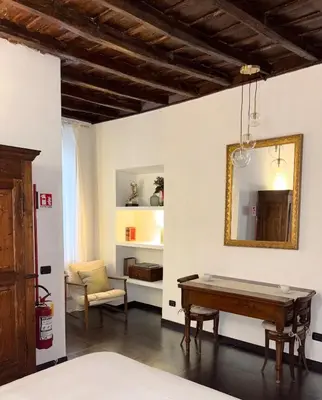 a room with a pool table and a mirror at Elegant Apartment in Rome's Historic Center in Rome