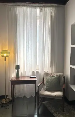 a room with a desk and a chair and a window at Elegant Apartment in Rome's Historic Center in Rome