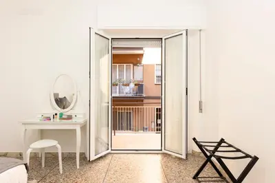 a room with a sliding glass door leading to a bedroom at Central Modern Apartment - Trastevere & Vaticano in Rome