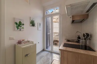 a small kitchen with a sink and a refrigerator at GuestHost - Sweety Apartment near MM Ottaviano in Rome