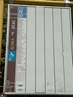 a metal sign with a timetable on it at Suite dell'Arte - Metro linea A in Rome