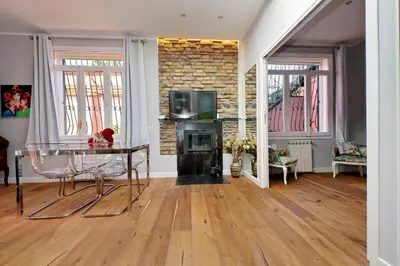 a living room with a glass table and a fireplace at Domus Monamì Dreams & Terrace in Trastevere in Rome