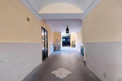 an empty hallway of a building with a door at Domus Monamì Dreams & Terrace in Trastevere in Rome