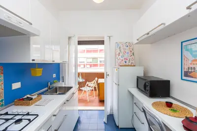 a kitchen with a sink and a refrigerator at Pop Studio Trastevere in Rome