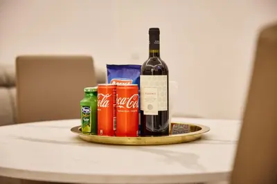 a bottle of wine and cans on a table at Casa di borgo in Rome