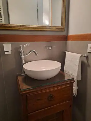 a bathroom with a white sink and a mirror at Romeo&Giulietta in Rome