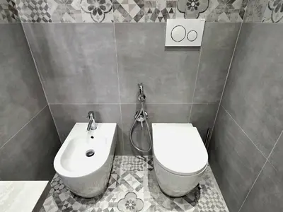 a bathroom with a toilet and a sink at Victoria Suites in Rome
