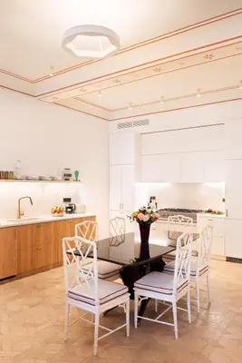 a dining room with a table and chairs at Idyllia - Casa Mina in Rome