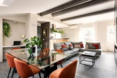 a living room with a glass table and a couch at Idyllia - Borgognona luxury home in Rome