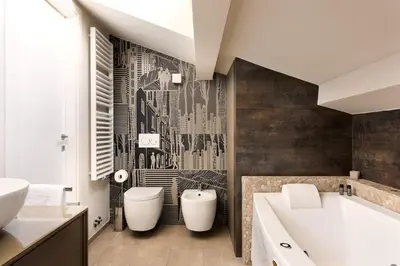 a bathroom with a large tub and a sink at Idyllia - Borgognona luxury home in Rome