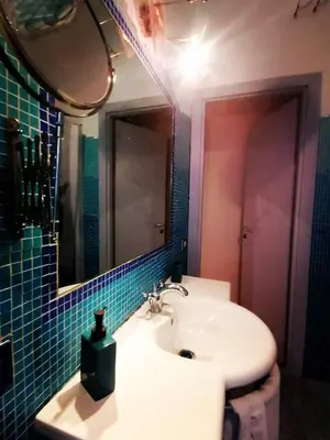 a bathroom with a sink and a mirror at A CASA di BICE in Rome