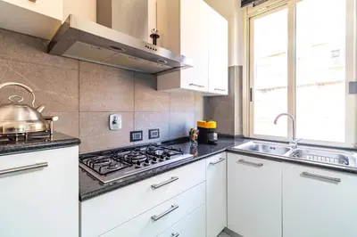 a kitchen with a stove and a sink at Vatican House in Rome