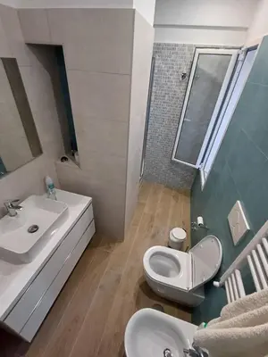 a bathroom with a sink and a toilet at Ascenza in Trasteverere in Rome