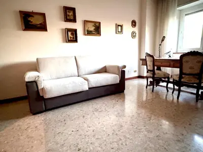 a living room with a couch and a table at Millys Apartment Rome Centre 