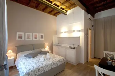 a bedroom with a bed with two teddy bears on it at Apartment Ripa 17 in Rome