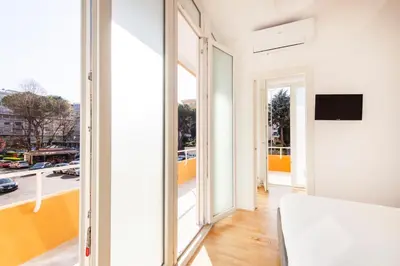 a room with a large window and a view of a city at Casanuova in Rome