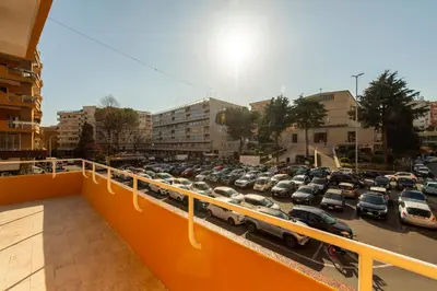a parking lot with a lot of cars parked at Casanuova in Rome