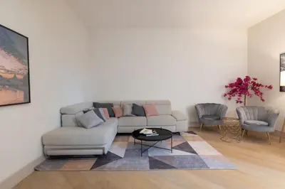 a living room with a couch and a table at Roma - Parione House in Rome