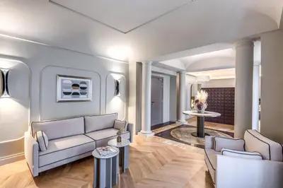a living room with a couch and a table at Dimora Coppelle - Adults Only in Rome